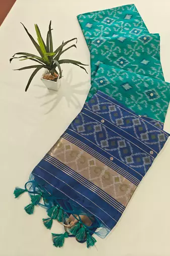 aqua blue raw silk pochampally ikkat saree with zari border