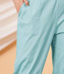 Women’s solid blue lycra ankle-length pants with side pockets