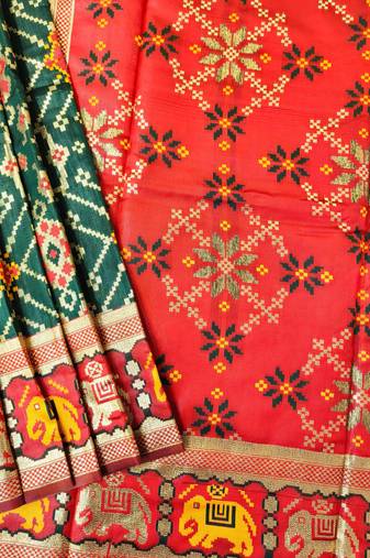 Dark green color zari and meena weaving patola silk saree