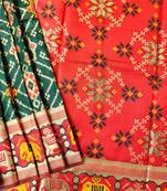 Dark green color zari and meena weaving patola silk saree
