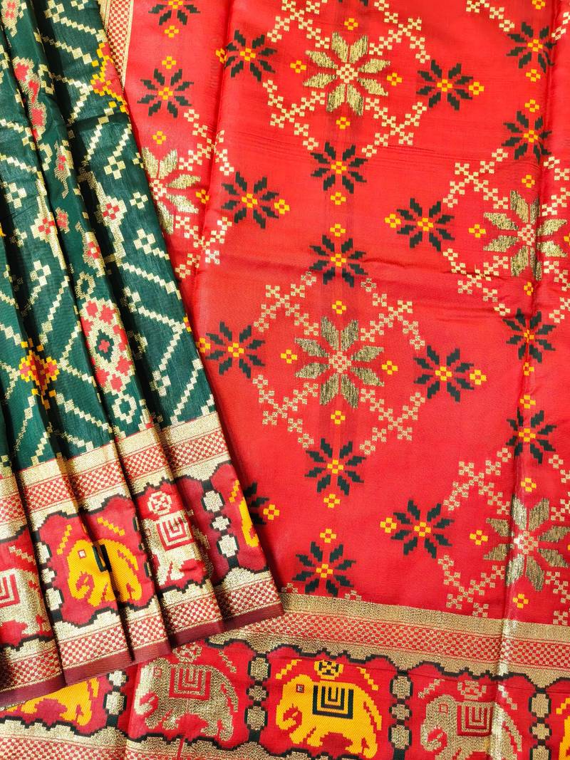 Dark green color zari and meena weaving patola silk saree