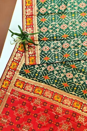 dark green zari and meena weaving patola silk saree