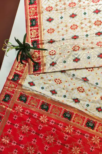 white zari and meena weaving patola silk saree