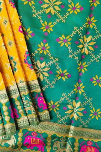 Yellow color zari and meena weaving patola silk saree