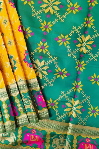Yellow color zari and meena weaving patola silk saree