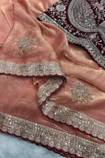 peach satin embroidered saree with designer maroon blouse