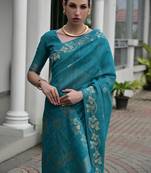 Teal color double shaded zari weaves jute linen silk saree