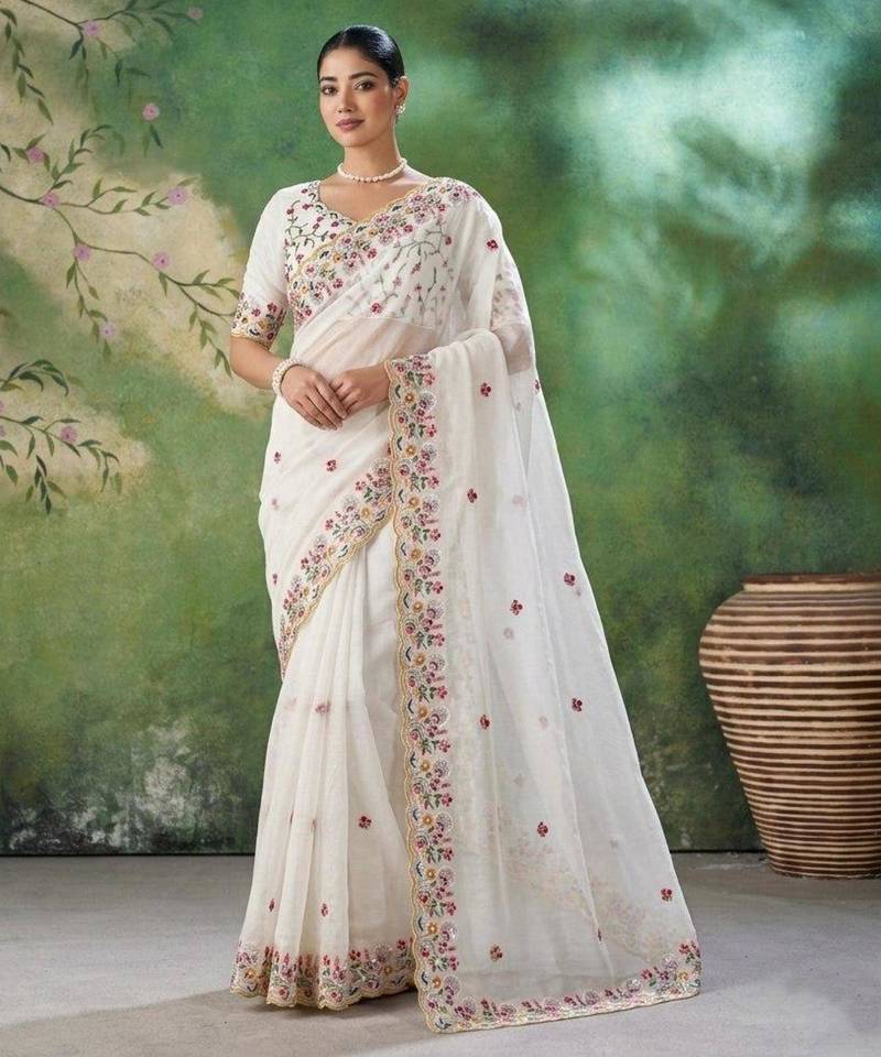 Cream silk blend embroidered saree