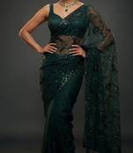 Dark green net embroidered saree