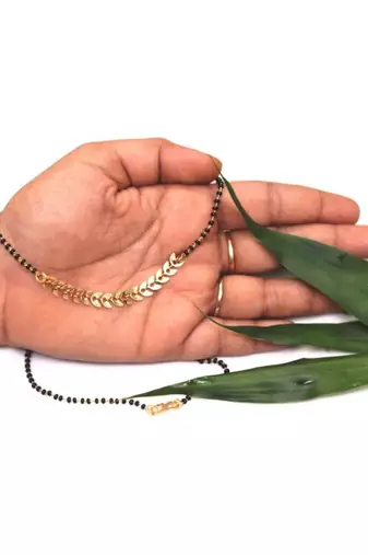 yellow alloy mangalsutra with leaf pattern design