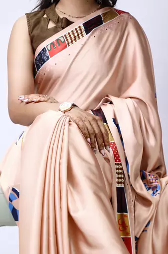 cream satin saree with folk printed designs