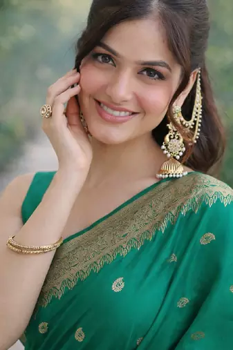 Teal green silk blend banarasi saree with unstitched blouse piece
