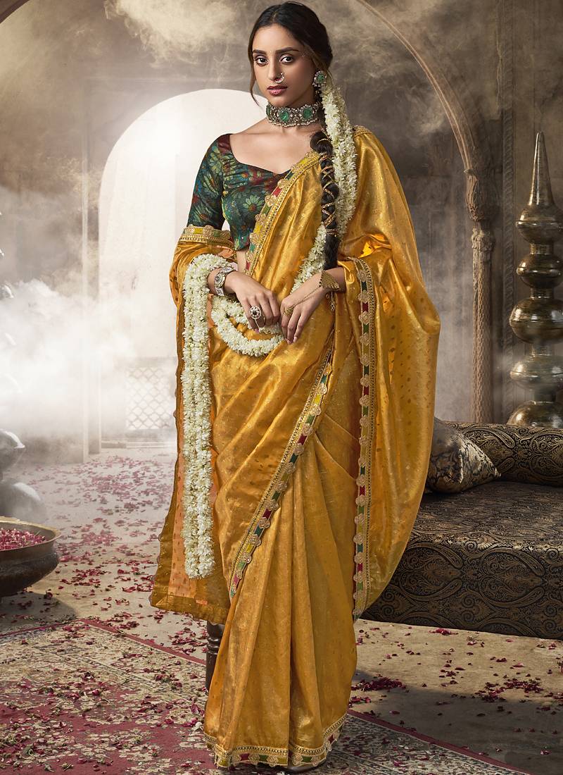 Yellow multi embroidered tissue silk saree