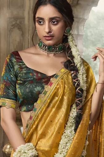 Yellow multi embroidered tissue silk saree