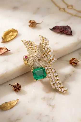 Luxury parrot design gold plated brooch with green stone & crystal detailing     designer pin for women & men