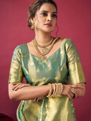 golden green tissue silk zari woven saree 4