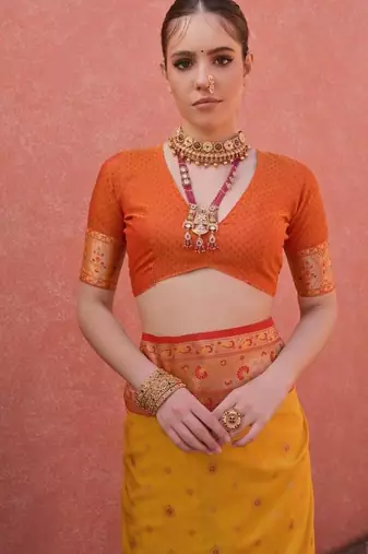 yellow and orange banarasi silk festive saree