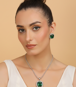 Silver electric bottle green stone pendant set