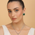 Silver electric bottle green stone pendant set