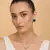 Silver electric bottle green stone pendant set