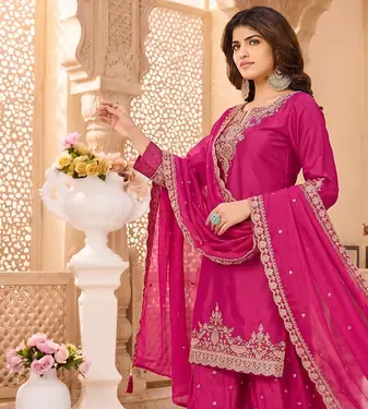Womens silk embroidered sharara suit with golden zari work and lace border dupatta