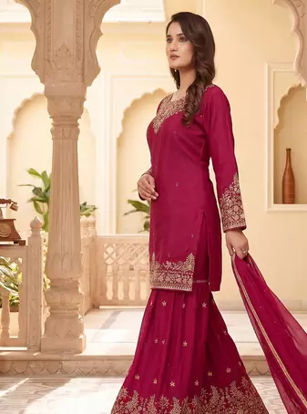 Womens elegant rani pink embroidered sharara suit with golden zari work and chiffon dupatta