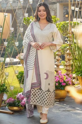 Cream color muslin fabric printed graceful girlie kurta set for party looks