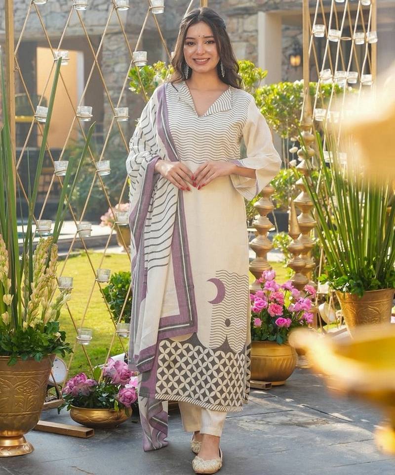 Cream color muslin fabric printed graceful girlie kurta set for party looks