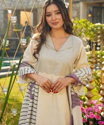 Cream color muslin printed graceful kurta set for party looks 3