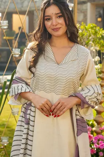 Cream color muslin printed graceful kurta set for party looks