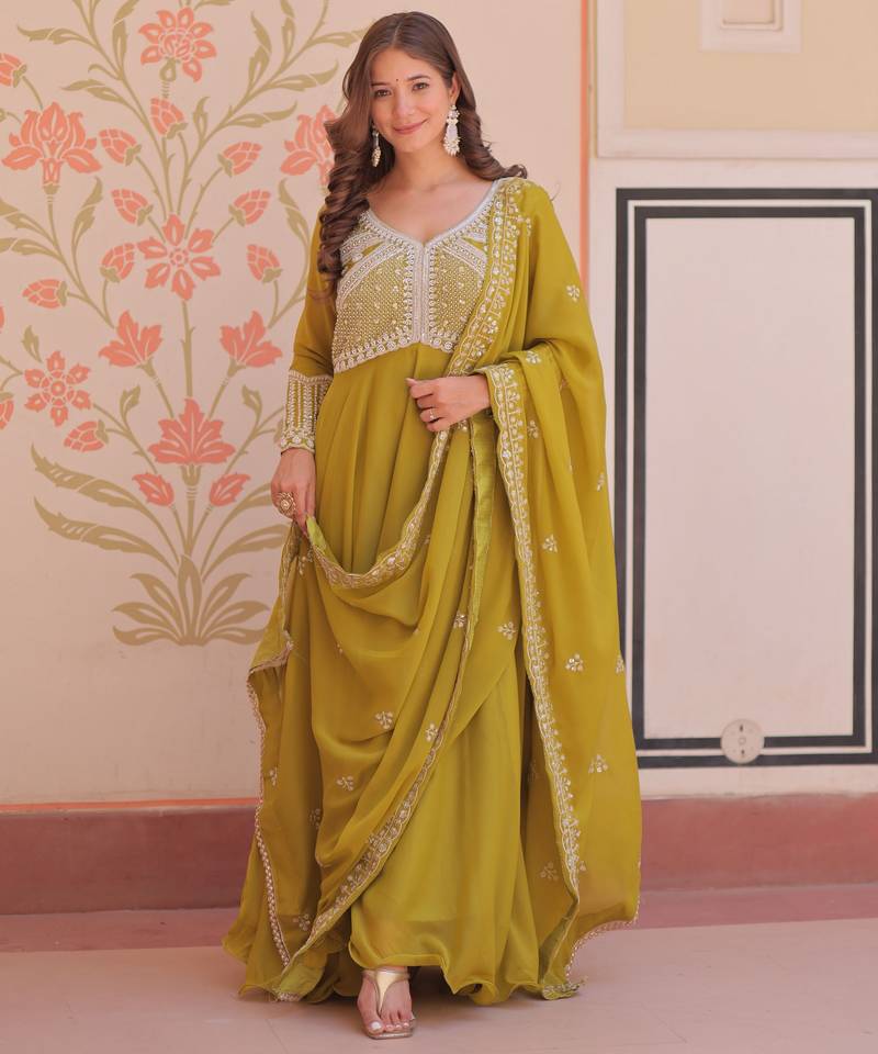 Green color heavy and ethnic coading embroidered with beads work wedding special gown with dupattta