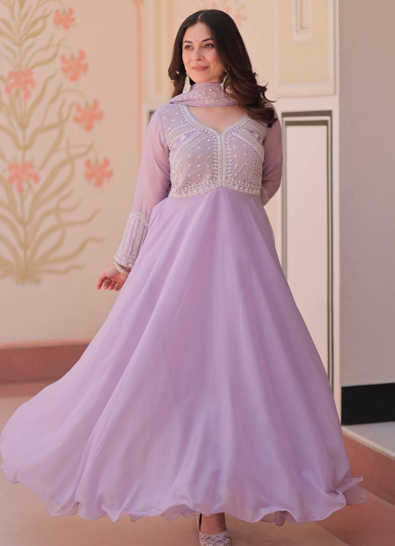 Lavender color heavy and ethnic coading embroidered with beads work wedding special gown with dupattta