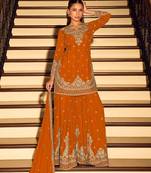 Orange chinon free size stitched suit with embroidery beats work