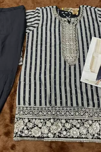 Black crepe silk free size stitched suit with embroidered mirror 
