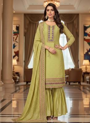 Green color smat and designer embrodiered sharara dress for ceremonial looks 1