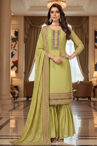 Green color smat and designer embrodiered sharara dress for ceremonial looks