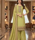 Green color smat and designer embrodiered sharara dress for ceremonial looks