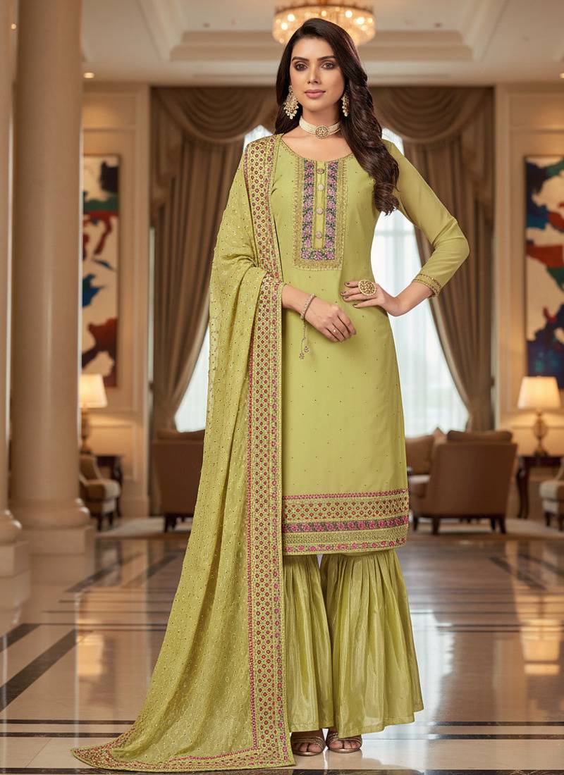 Green color smat and designer embrodiered sharara dress for ceremonial looks