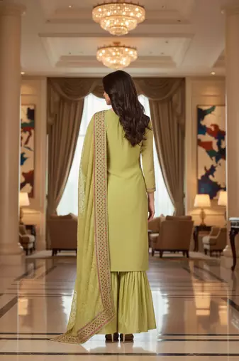 Green color smat and designer embrodiered sharara dress for ceremonial looks