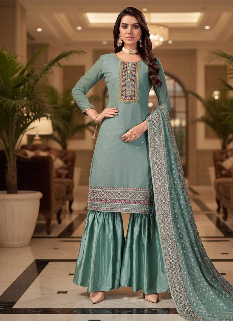 Peach color smat and designer embrodiered sharara dress for ceremonial looks