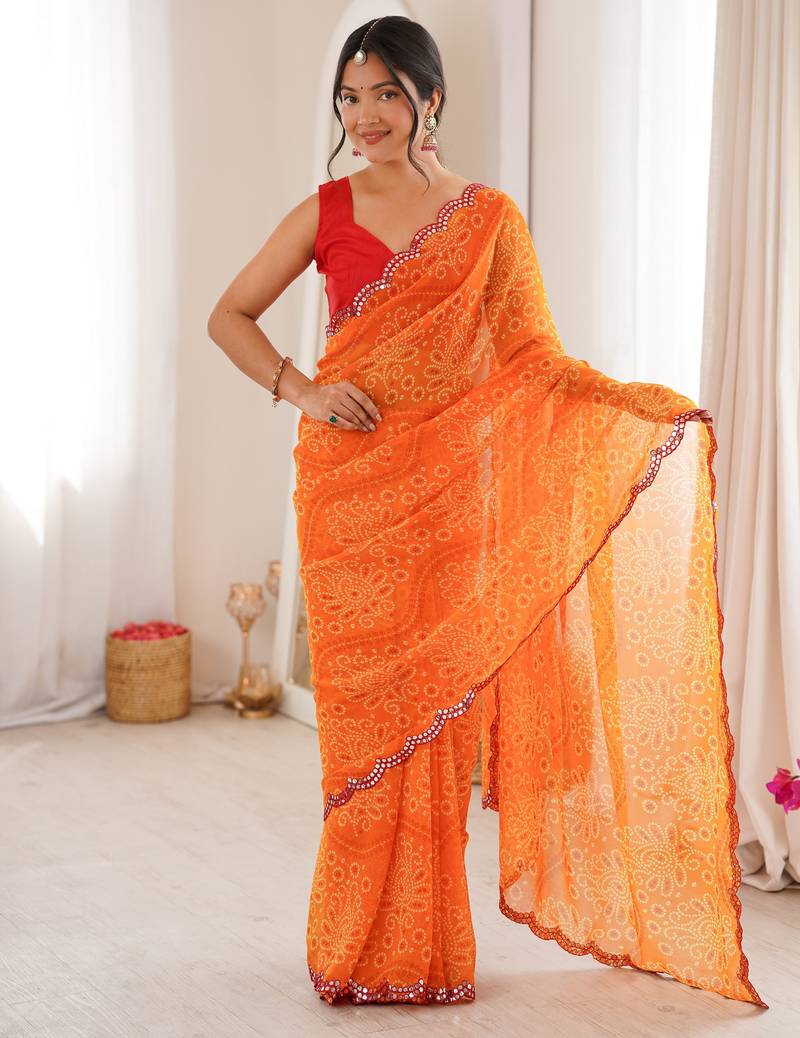 Orange color georgette fabric bandhej print traditional saree