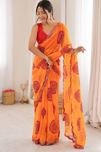 Orange color faux georgette bandhani printed traditional festive saree