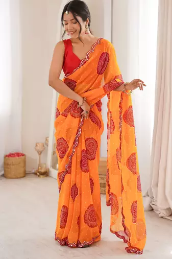Orange color faux georgette bandhani printed traditional festive saree