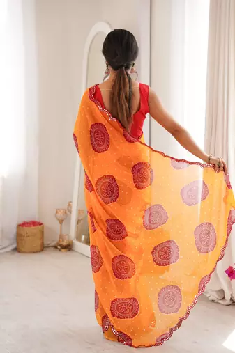 Orange faux georgette bandhani printed traditional festive saree