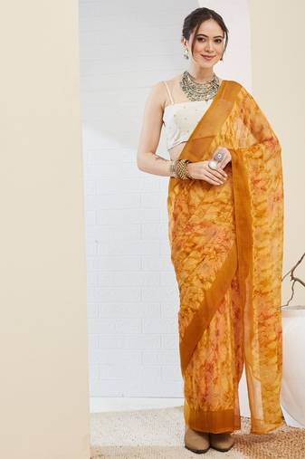 Yellow color bollywood style printed chiffon saree for ethnic party looks