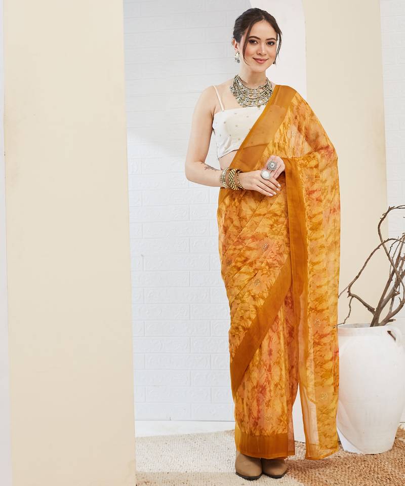 Yellow color bollywood style printed chiffon saree for ethnic party looks