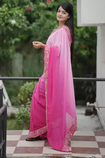 Pink faux georgette padding saree with smart and trendy mirror work