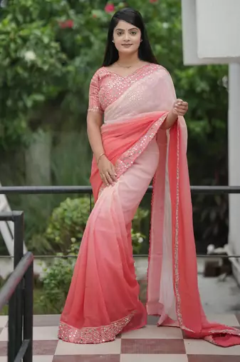 Peach faux georgette padding saree with smart and trendy mirror work