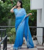 Blue faux georgette fabric beautiful padding saree with smart and trendy mirror work