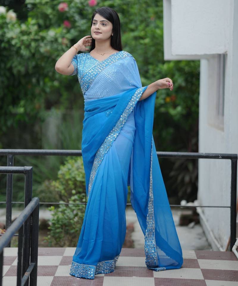 Blue color faux georgette fabric beautiful padding color saree with smart and trendy mirror work
